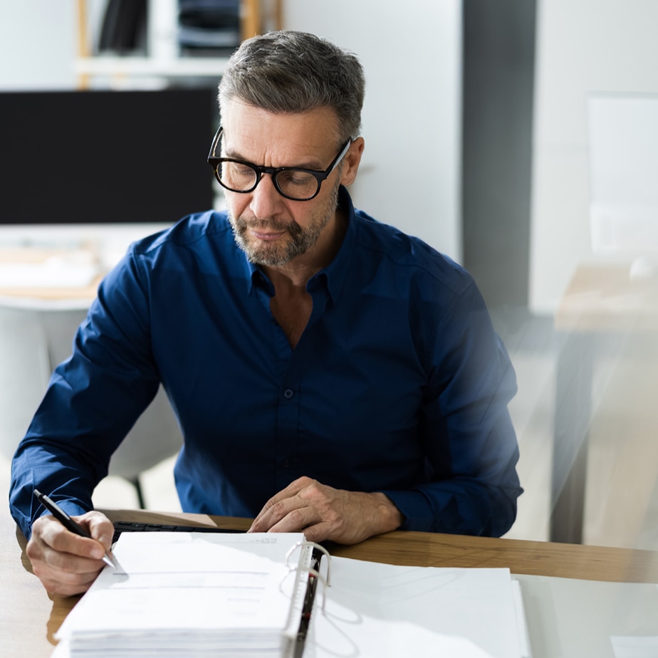 business man reviewing audit documentation square